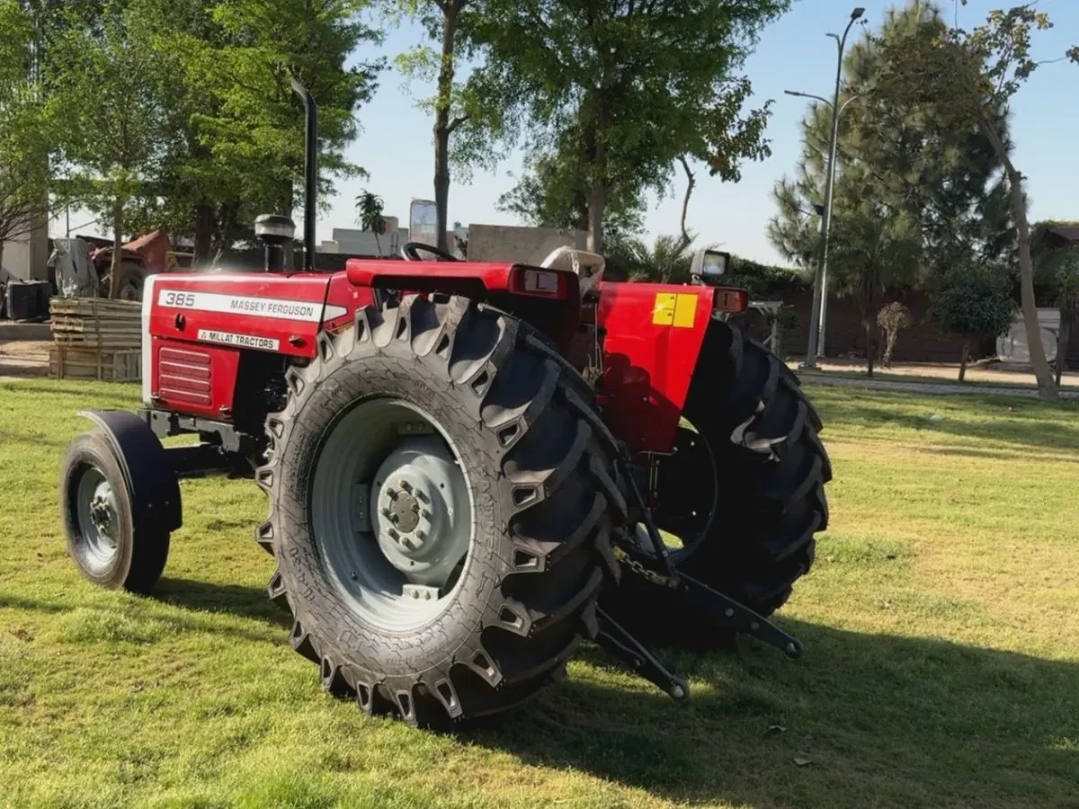 Rear-side archive view of a red MF 385 tractor