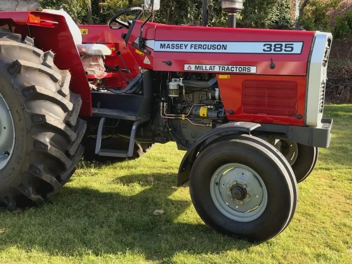 Side archive view of the same red MF 385 tractor